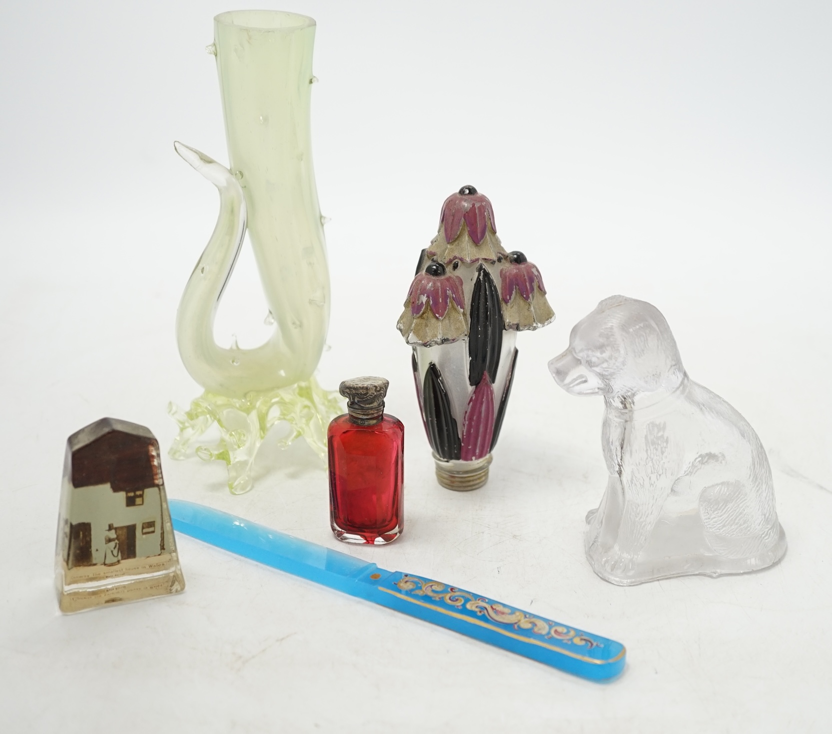 A collection of mixed Victorian glass perfume bottles and files, souvenir paperweights, a glass letter opener and vase, etc. Condition - fair to good